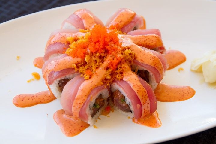 Pink Lady roll topped with tuna and masago