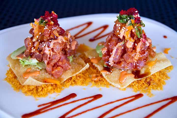Tuna tartar on crisp wonton with sauce drizzle