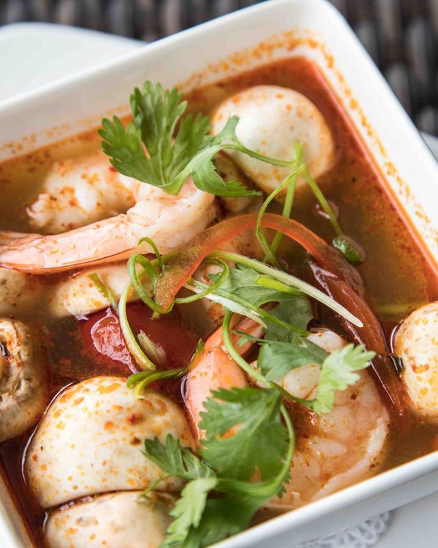 Tom Yum Goong soup with shrimp, mushrooms and cilantro